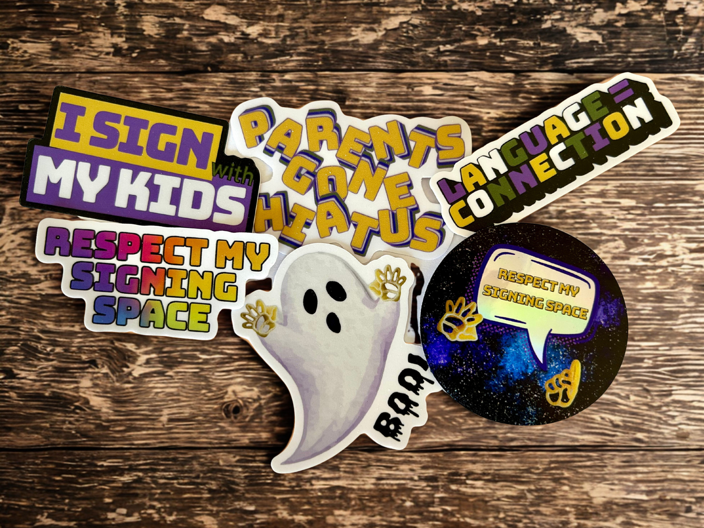 Colorful stickers including a ghost handshapes sticker for Halloween and catchy phrases