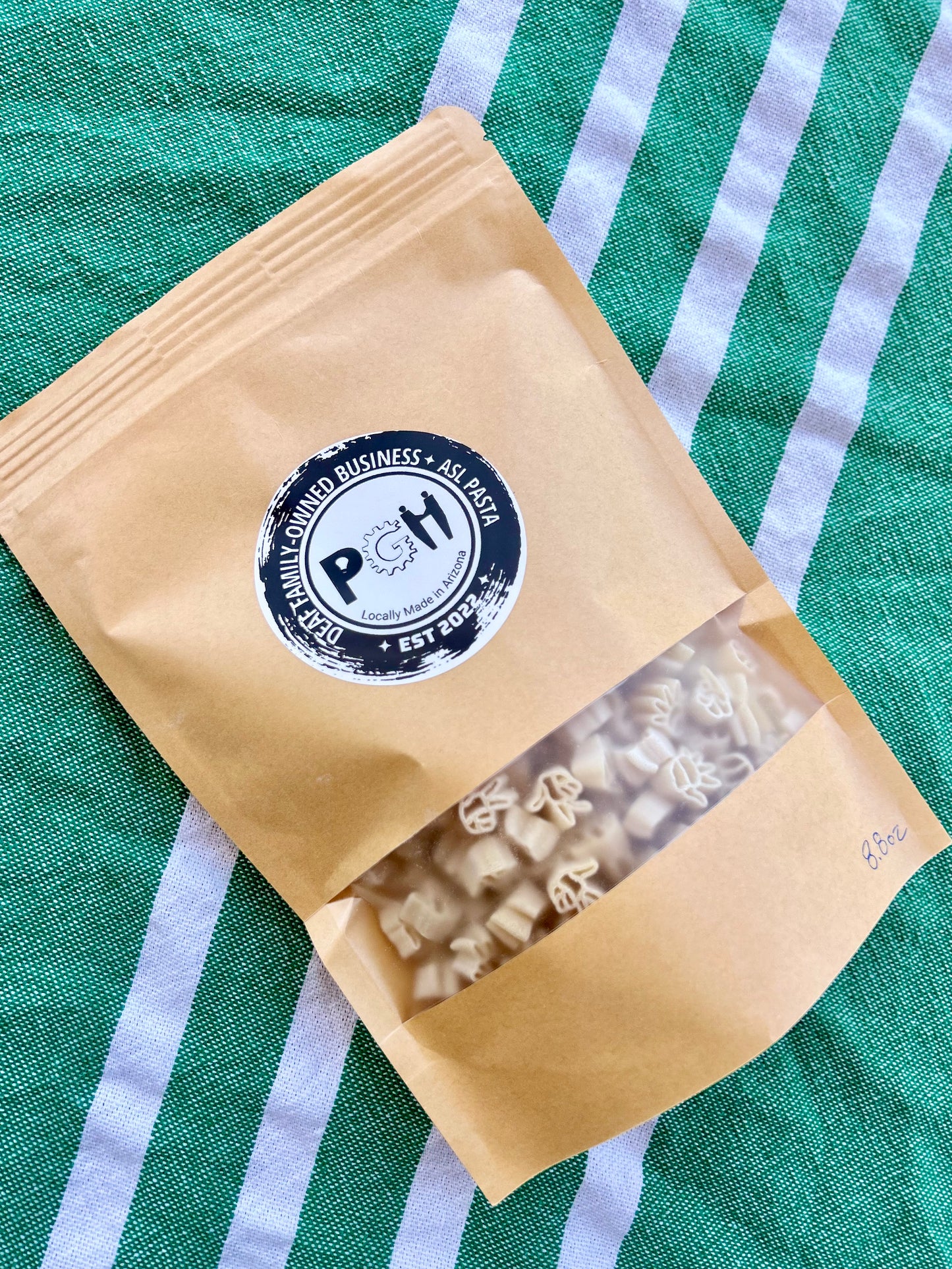 Parents Gone Hiatus kraft pouch showing american sign language handshape pasta 1-3-5 with basil pesto mix seasoning meal kit