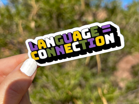 Colorful language connection sticker held in hand with a natural background