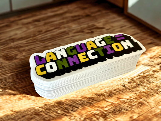 Colorful language connection sticker featuring bold letters on a wooden surface