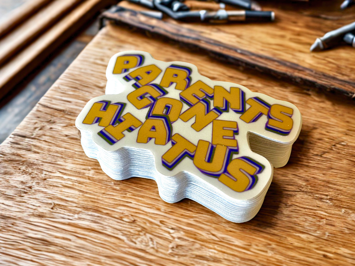 Colorful Parents Gone Hiatus sticker on a wooden surface, perfect for personalizing items