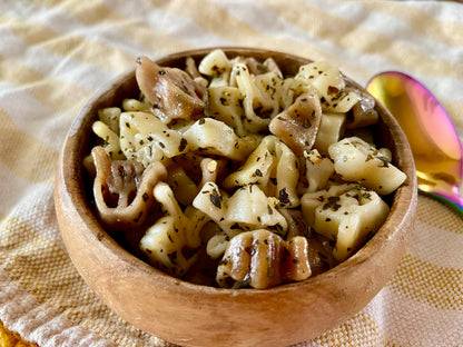 american sign language handshape pasta 1-3-5 with basil pesto mix seasoning meal kit in wooden bowl garnished with herbs
